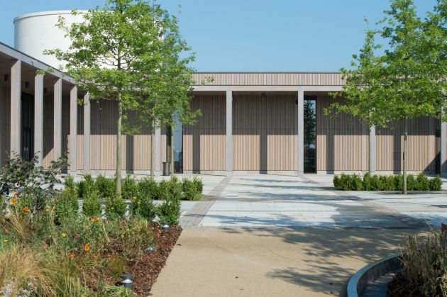 grey stained timber cladding panels to NMA Building by BCL Timber